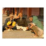 A group of saddhus sit at the side of the road in Jaipur, India.